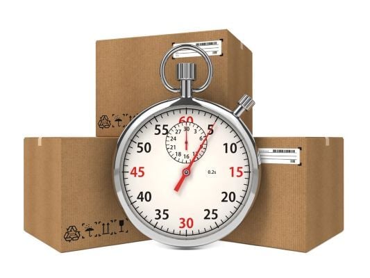 Stopwatch Over a Carton Boxes. Express Delivery Concept (400px)